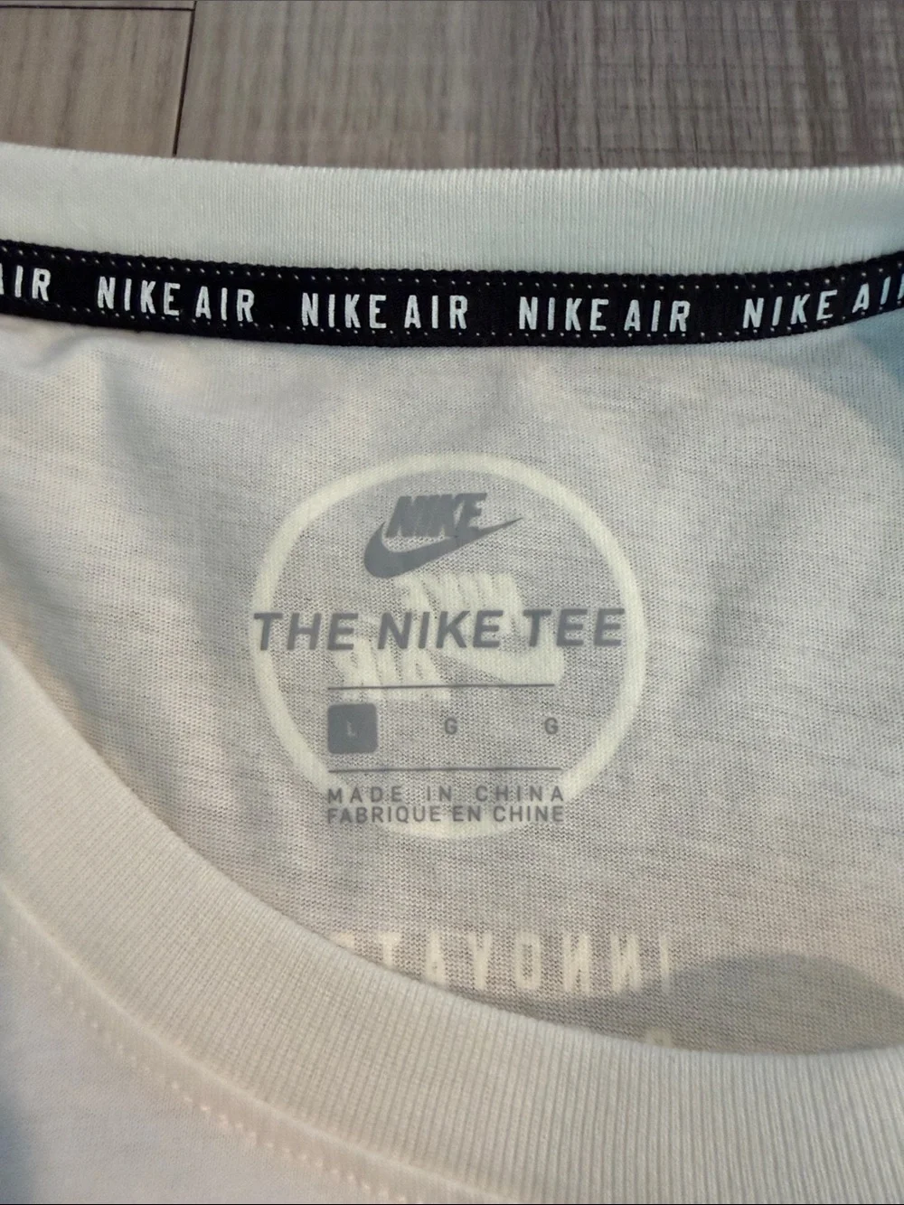 Nike White Short Sleeve Tee with Vertical 'Nike Air' Logo